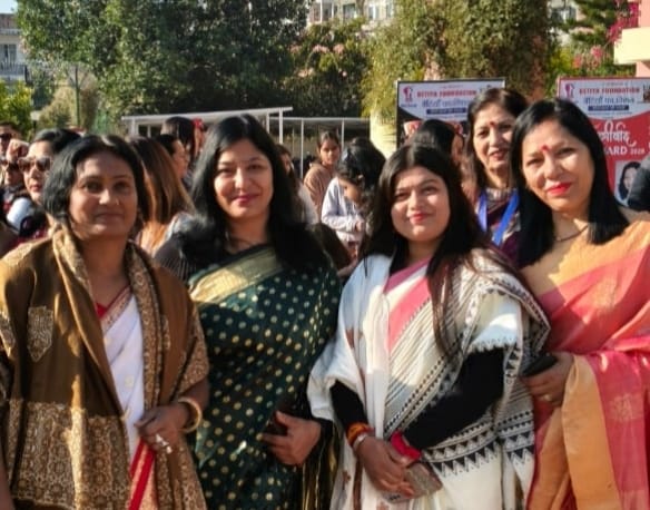 A joyful moment with legal colleagues in the office, celebrating with a cake and sweets to mark a professional milestone.